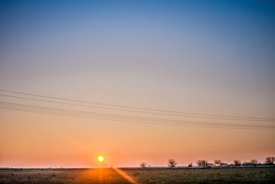 Scenic view of sunset over land