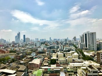 High angle view of buildings in city against sky