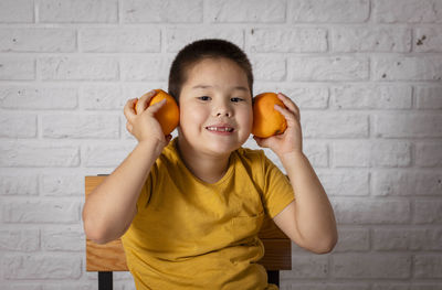 Citrus cheers, colorful snapshot of a young vitamin c enthusiast