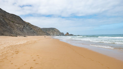 Scenic view of beach against sky