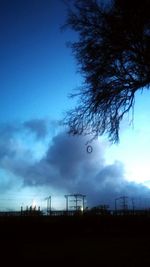 Scenic view of field against cloudy sky