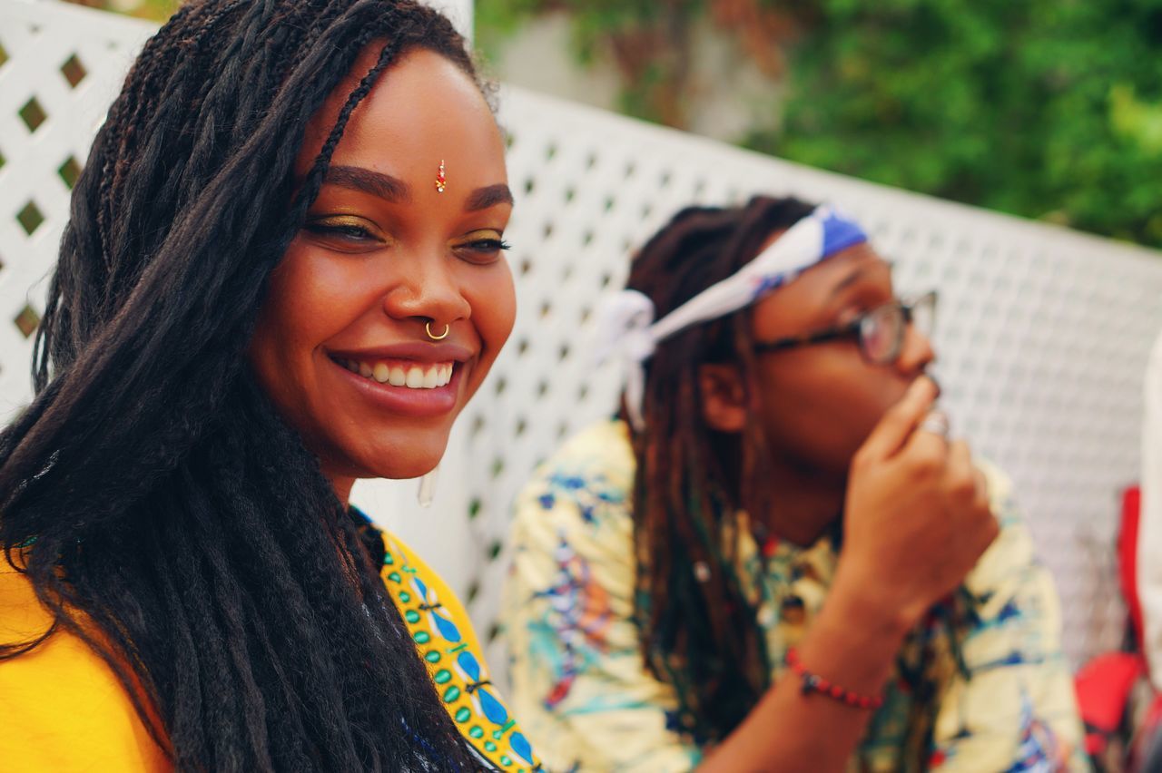 person, lifestyles, looking at camera, portrait, leisure activity, smiling, happiness, young adult, casual clothing, front view, togetherness, young women, focus on foreground, bonding, headshot, toothy smile