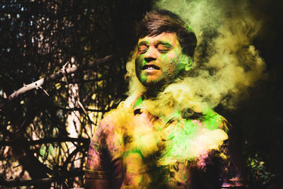 Man covered in powder paint during holi