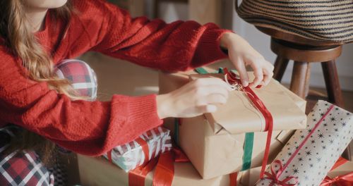 Midsection of woman holding gift