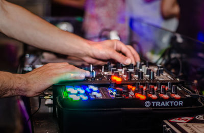Midsection of man playing piano