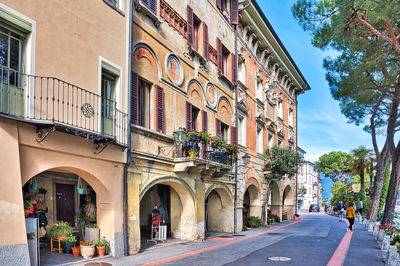 Street amidst buildings in city against sky