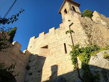 Low angle view of building against blue sky