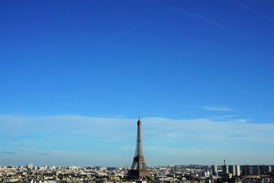 View of cityscape against blue sky