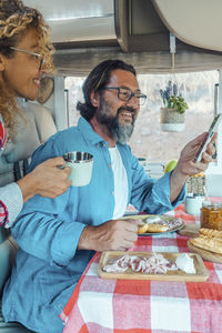 Portrait of senior couple sitting at home