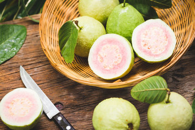 High angle view of fruits in basket on table