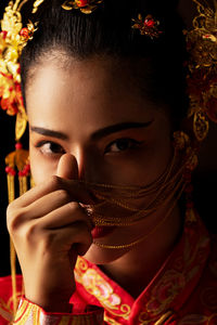 Close-up portrait of woman in traditional clothes