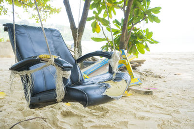 Swings were made with old not the job on the beach.