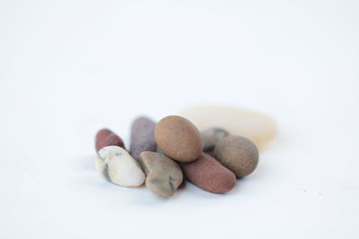 Close-up of eggs over white background