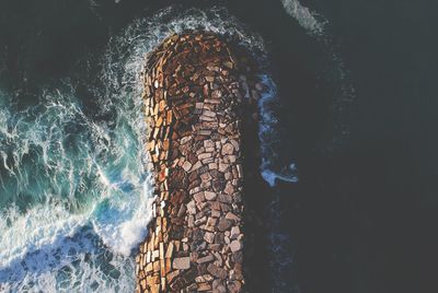 Sea waves splashing on rocks