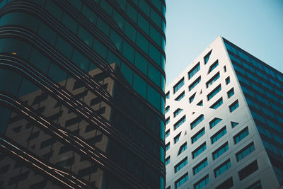 Low angle view of modern building against sky in city