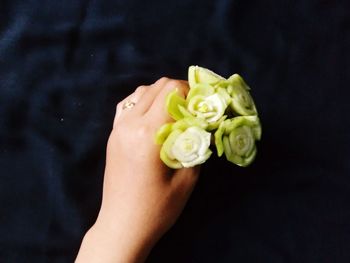 Close-up of rose holding bouquet