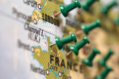 Close-up of thumbtack on map