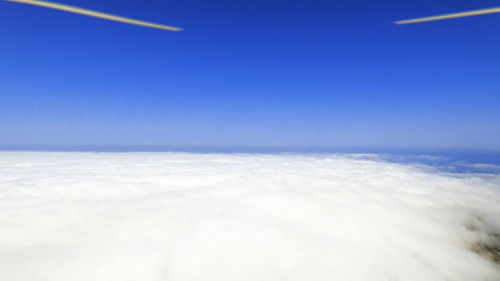 Scenic view of landscape against blue sky