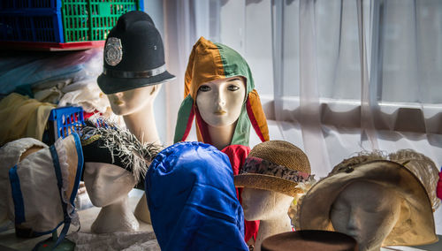 Various headwear on mannequins