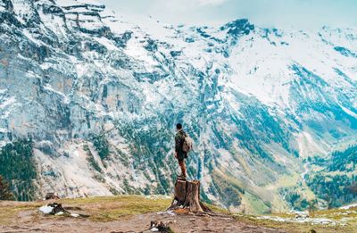 Man standing on snowcapped mountain