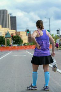 Woman standing on city street