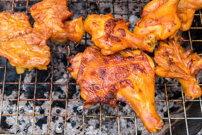 High angle view of chicken on barbecue grill