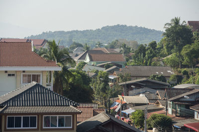 Houses in village against clear sky