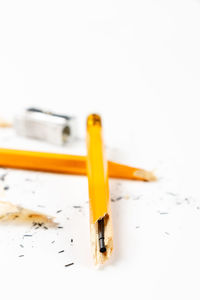 Close-up of cigarette against white background