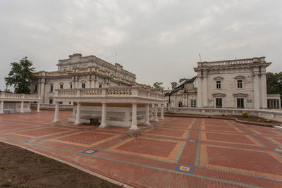 Facade of historic building against sky