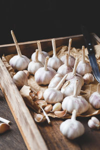 Close-up of garlic bulbs on table