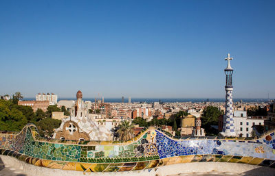 View of cityscape against clear blue sky