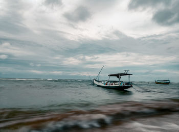 View of sailboat in sea against sky