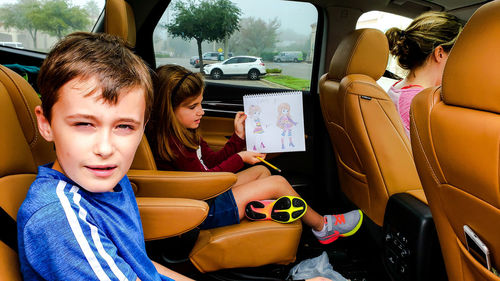 High angle view of children in car