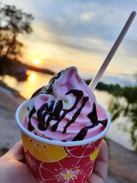 Close-up of hand holding ice cream