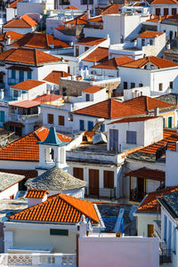 White houses with red roofs in skopelos town, greece.