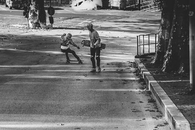 Woman standing on footpath