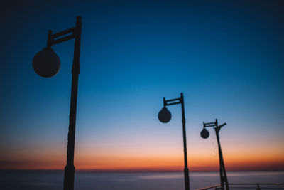 Low angle view of street light against sky