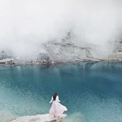 Scenic view of lake during foggy weather