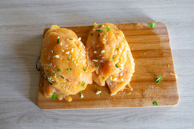 High angle view of bread on cutting board