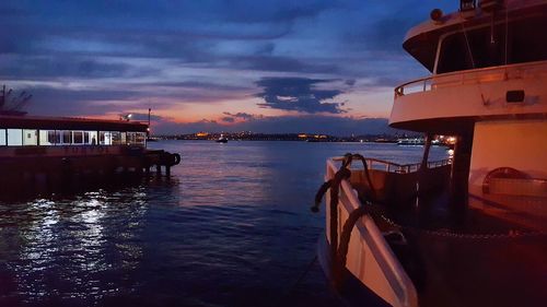 Boat sailing on sea against sky during sunset