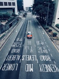 High angle view of car and signs on road in city