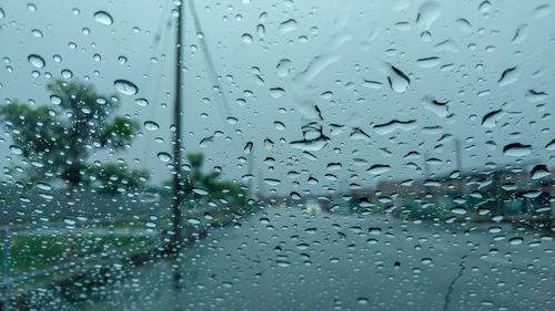 Full frame shot of wet glass window during rainy season