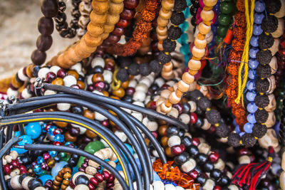 Close-up of multi colored jewelry for sale in market