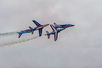 Low angle view of airplane flying in sky