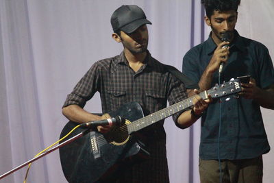 Young man playing guitar