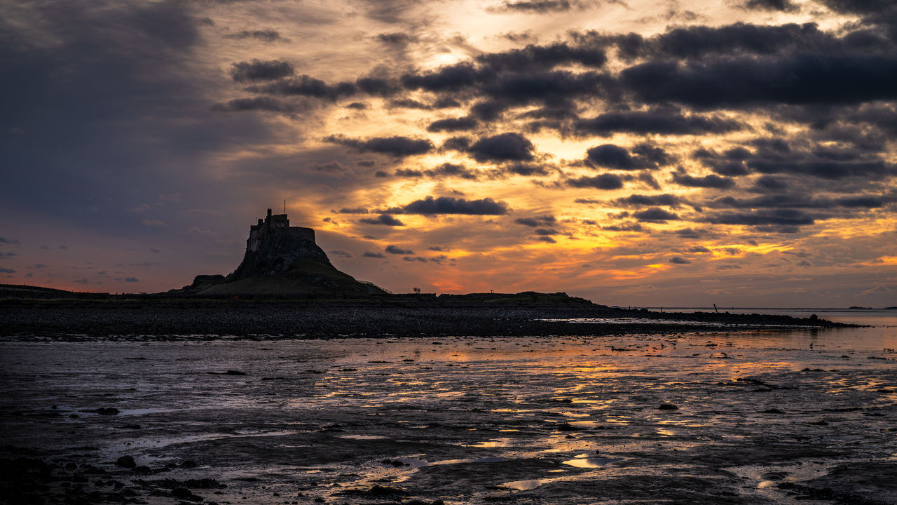 sky, water, cloud, sea, sunset, beauty in nature, scenics - nature, horizon, nature, land, coast, travel destinations, dawn, environment, ocean, evening, dramatic sky, landscape, beach, shore, tranquility, reflection, no people, travel, wave, outdoors, tranquil scene, seascape, tourism, mountain, afterglow, rock, idyllic, sun