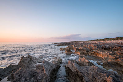 Scenic view of sea against sky during sunset