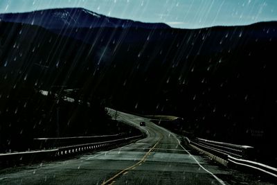 Illuminated road at night