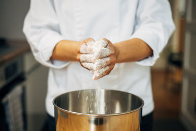 Midsection of man holding ice cream