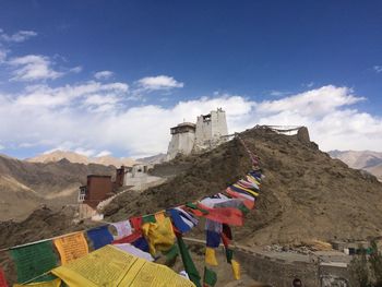 Colorful prayer flags on himalayas against sky